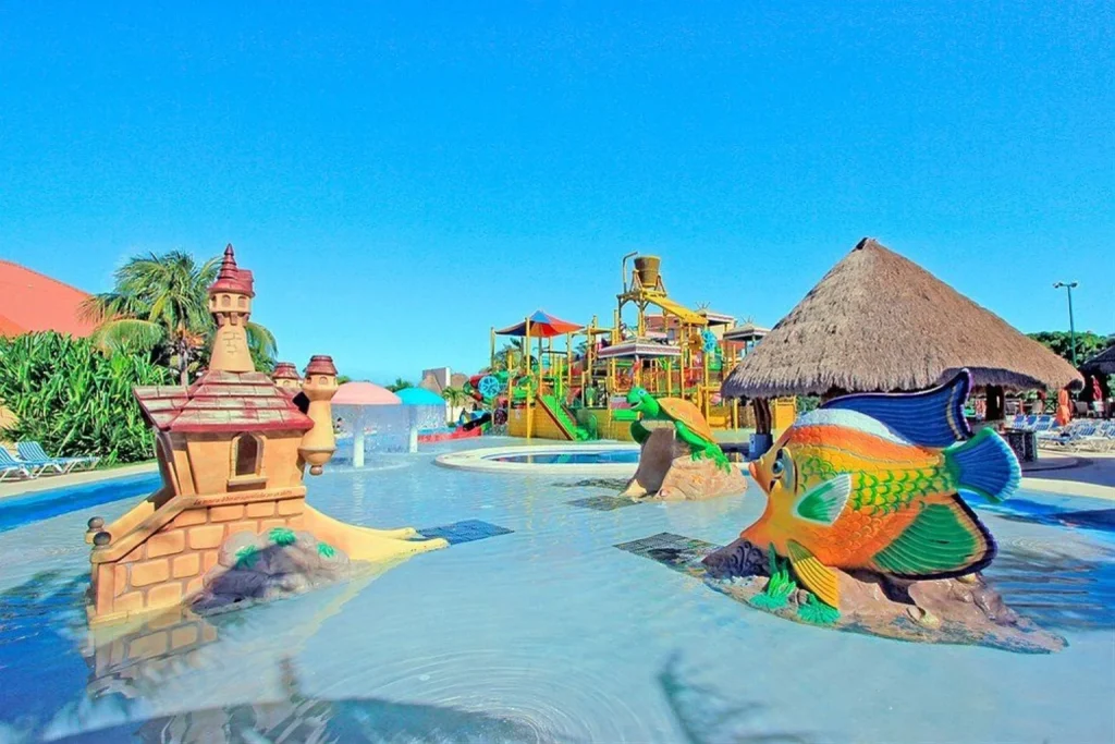 Kids water play area with fish and castle features at All Ritmo Cancun Resort & Waterpark in Cancun, Mexico