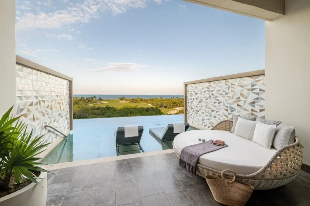 Private pool terrace with loungers and ocean view at Atelier Playa Mujeres in Cancun