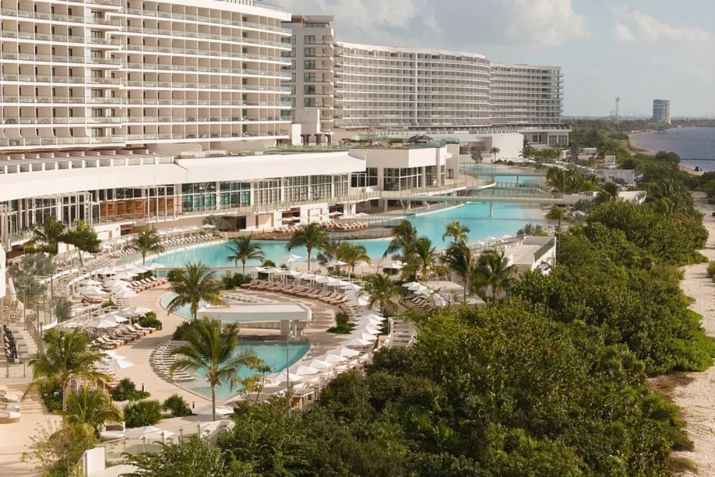 Pools and resort grounds with coastal views at AVA Resort Cancun