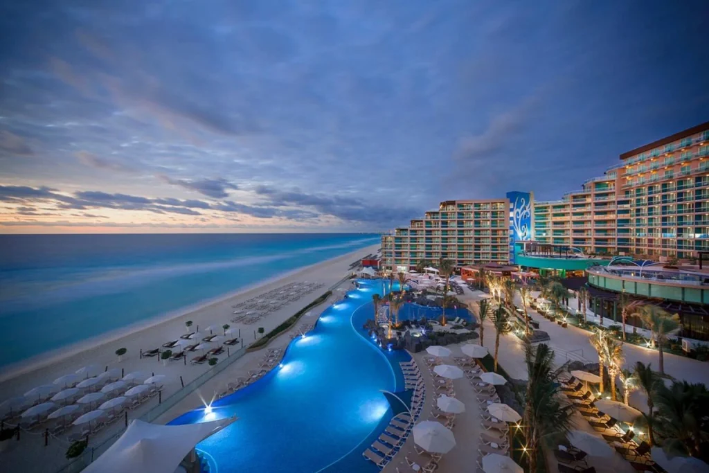 A sweeping beachfront pool with ocean views and direct access to the white-sand beach, Hard Rock Hotel Cancun