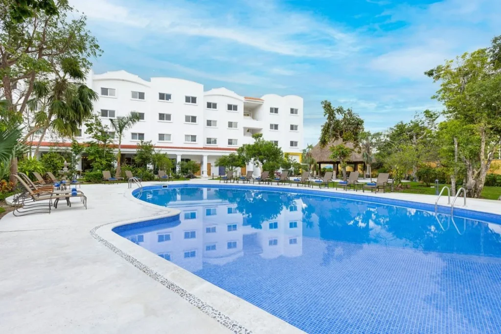 Outdoor pool in the courtyard at Courtyard by Marriott Cancun Airport in Cancun, Mexico
