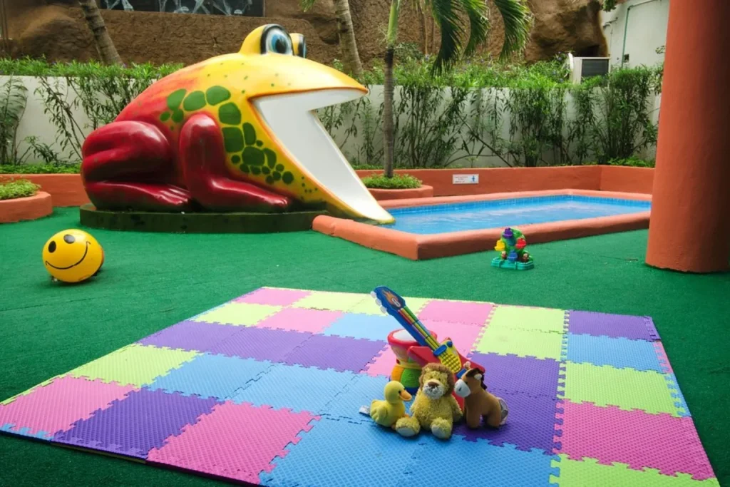 Kids’ play area with a small pool and frog slide at Crown Paradise Club Cancun, Mexico