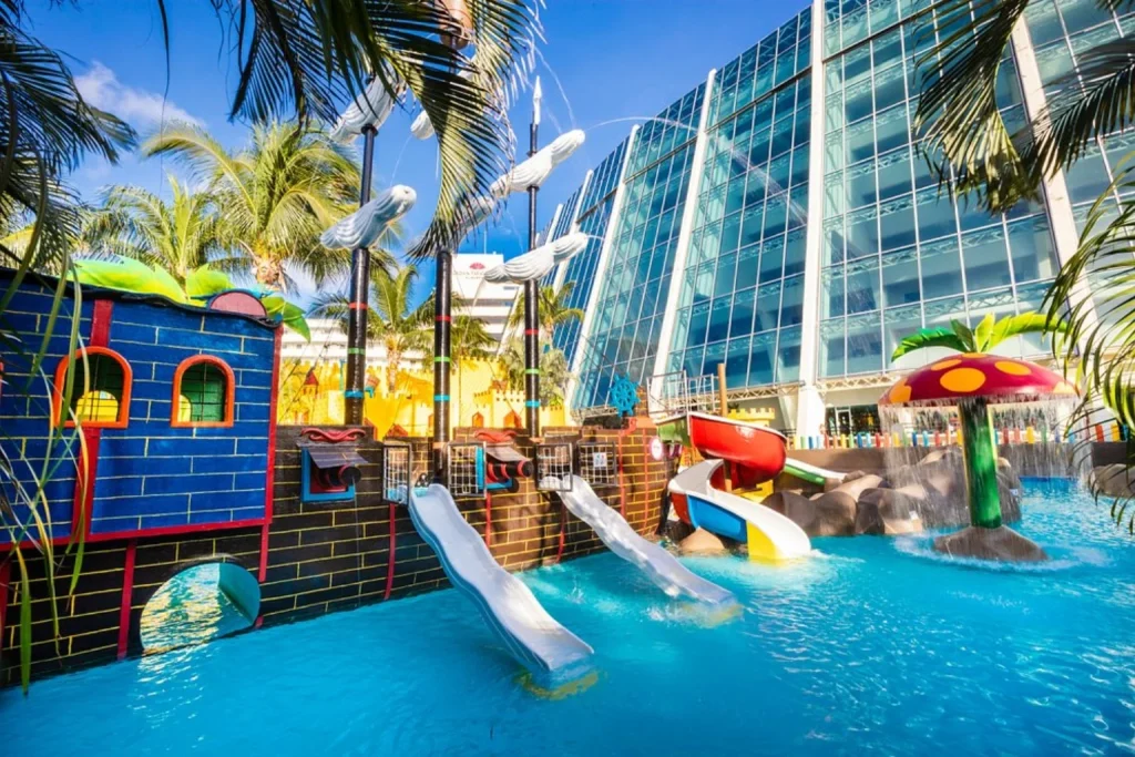 Pirate ship water play area with slides and splash features at Crown Paradise Club Cancun, Mexico