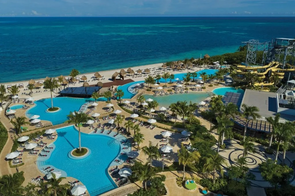 Pools and water park overlooking the ocean at Dreams Natura Resort & Spa in Cancun, Mexico