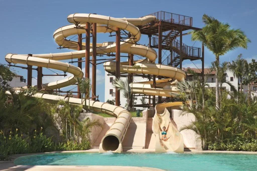 Water slides and swimming pool at Dreams Playa Mujeres Golf & Spa Resort in Playa Mujeres, Cancún