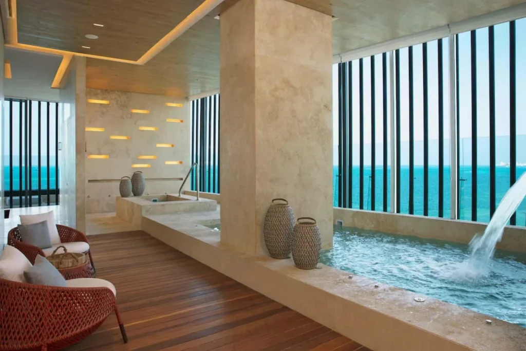 Spa pool with water feature and ocean view at Dreams Vista Cancun