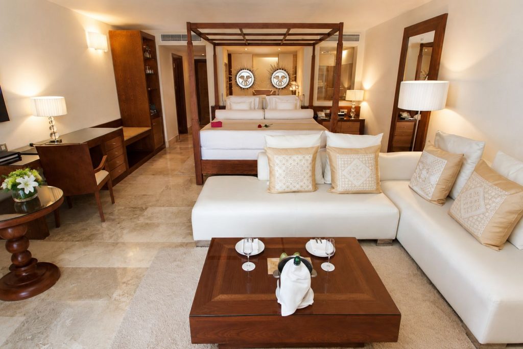 Luxury suite with a canopy bed at Excellence Playa Mujeres in Cancun, Mexico
