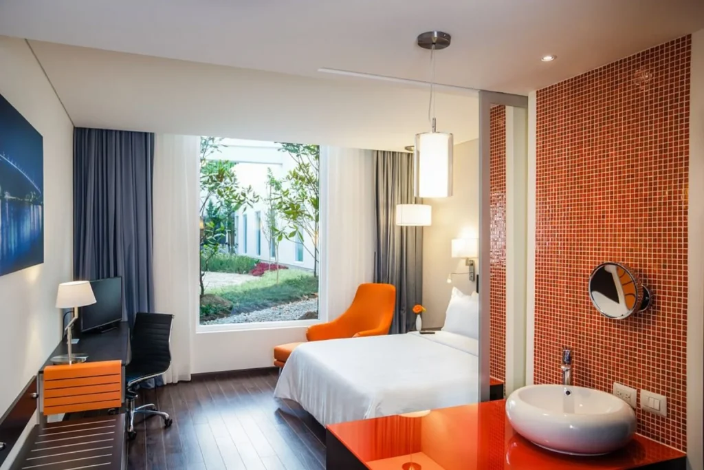 Modern guest room at Fiesta Inn Plaza Central Aeropuerto in Cancún, Mexico.