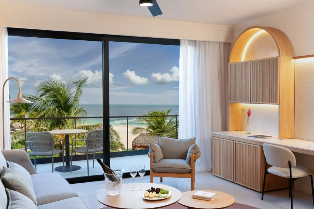 Ocean-view suite with a spacious living area and private balcony at Finest Riviera Cancun