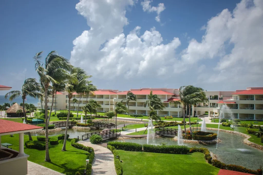 Landscaped tropical gardens with palm trees, fountains and winding lagoons, Moon Palace Cancun, Cancun