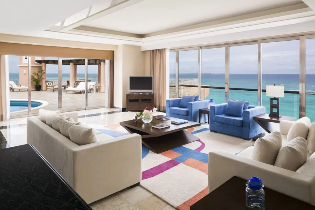 Oceanfront suite with a spacious living area at Grand Fiesta Americana Coral Beach in Cancún.