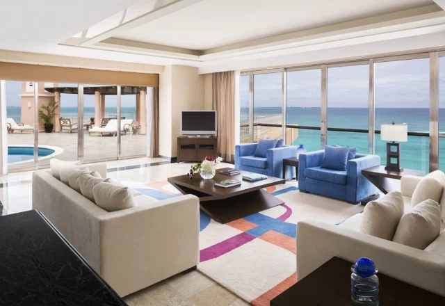Oceanfront suite with a spacious living area at Grand Fiesta Americana Coral Beach in Cancún.
