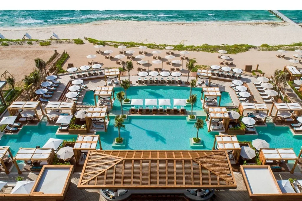 Luxury beachfront pools with private cabanas and loungers overlooking the Caribbean Sea, Grand Luxxe at Vidanta Riviera Maya, Mexico