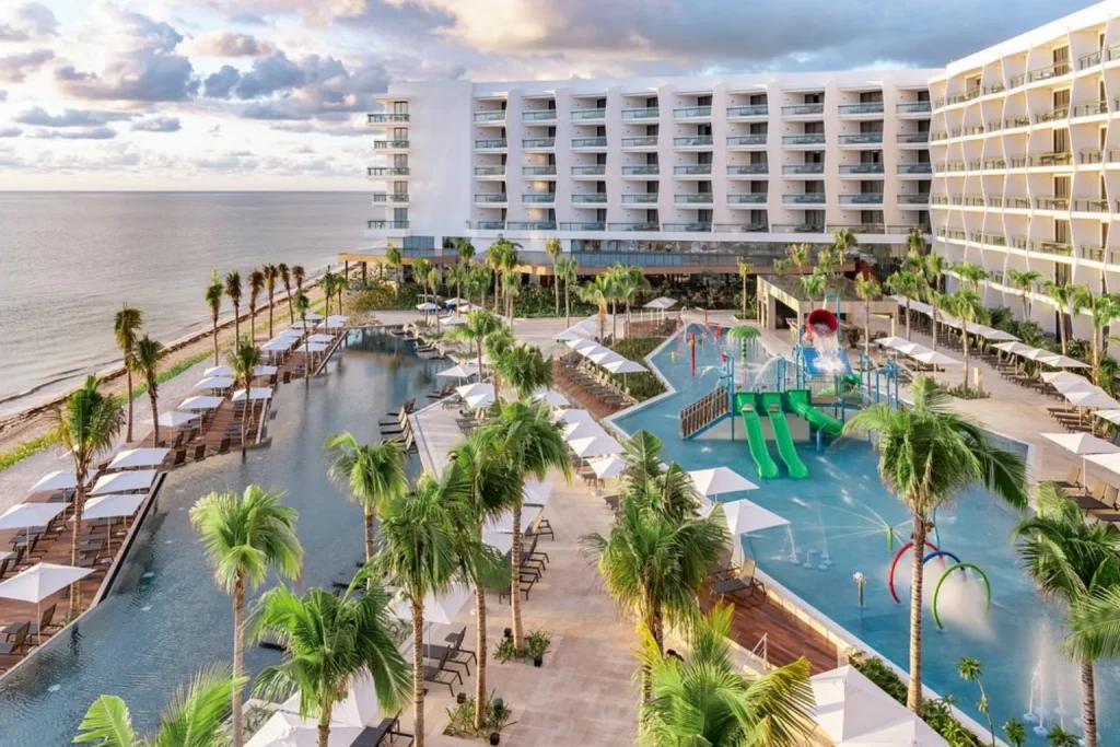 Pools and kids’ water play area overlooking the ocean at Hilton Cancun, an All-Inclusive Resort, Mexico