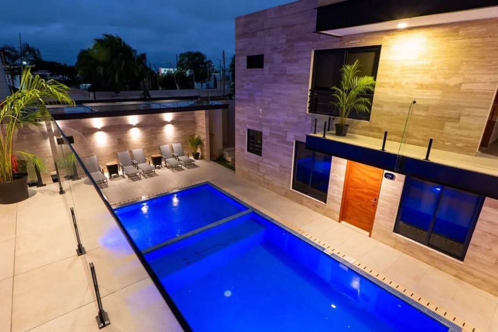 Outdoor pool at night at Hotel 28 Cancun in Cancún, Mexico.