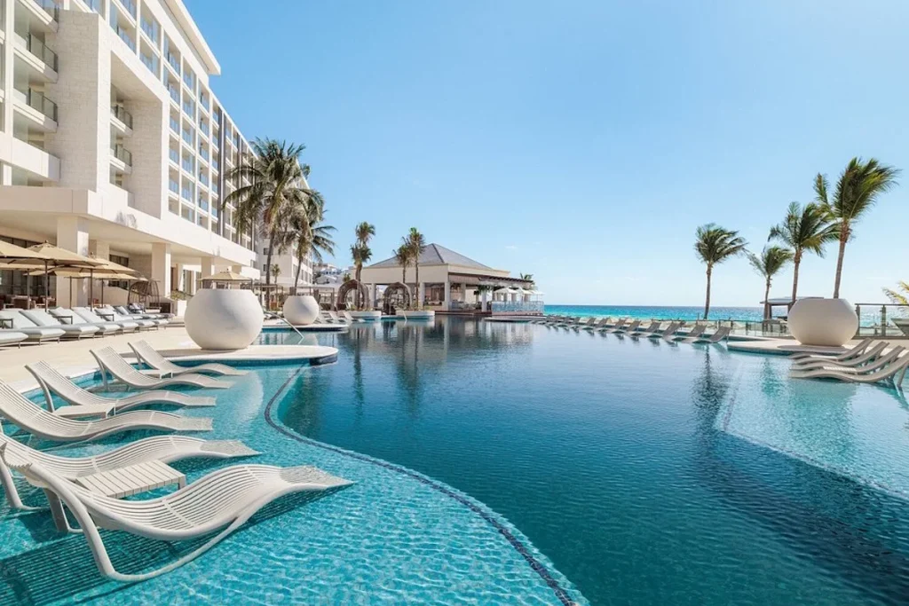 Oceanfront infinity pool with in-water loungers at Hyatt Zilara Cancún
