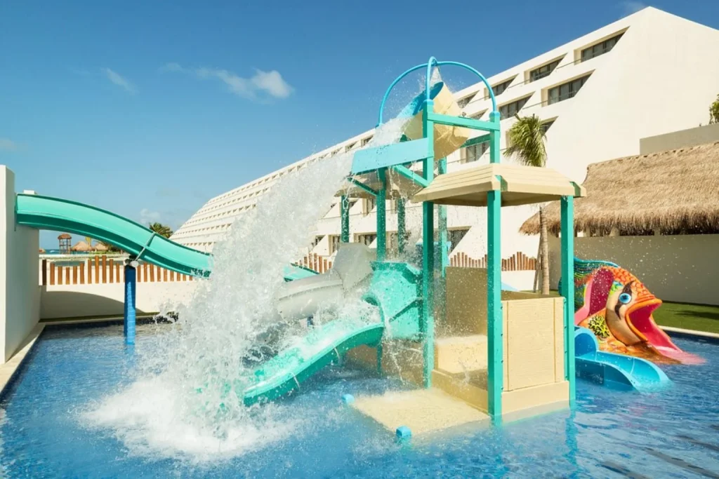 Kids’ water play area with slides and splash bucket at Hyatt Ziva Cancun, Mexico