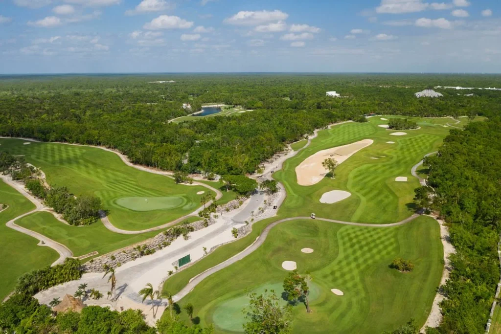 Aerial view of a golf course with manicured fairways, greens and sand bunkers, Iberostar Selection Paraiso Lindo, Riviera Maya