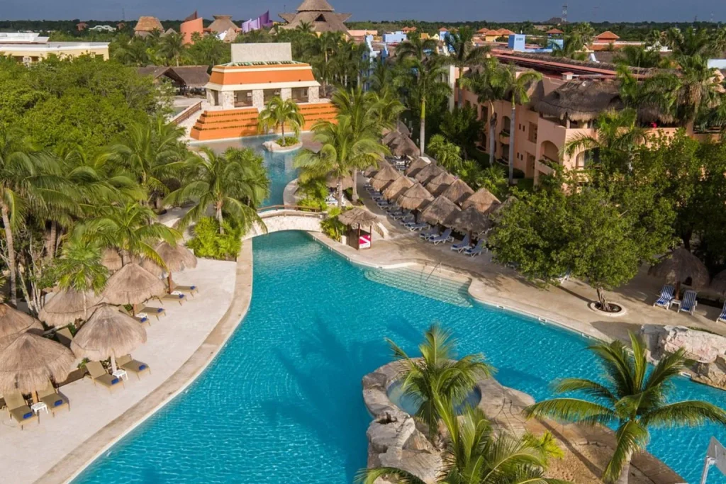 Pool surrounded by tropical landscaping at Iberostar Selection Paraiso Lindo in Riviera Maya, Mexico