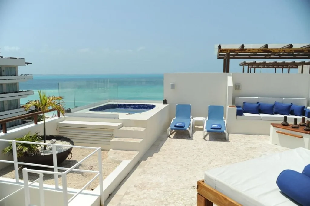 Ocean-view rooftop terrace with hot tub at Ixchel Beach Hotel on Isla Mujeres near Cancun