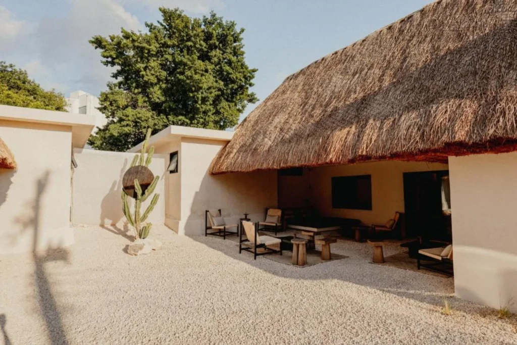 Private courtyard with outdoor lounge at IXUM in Cancún, Mexico.