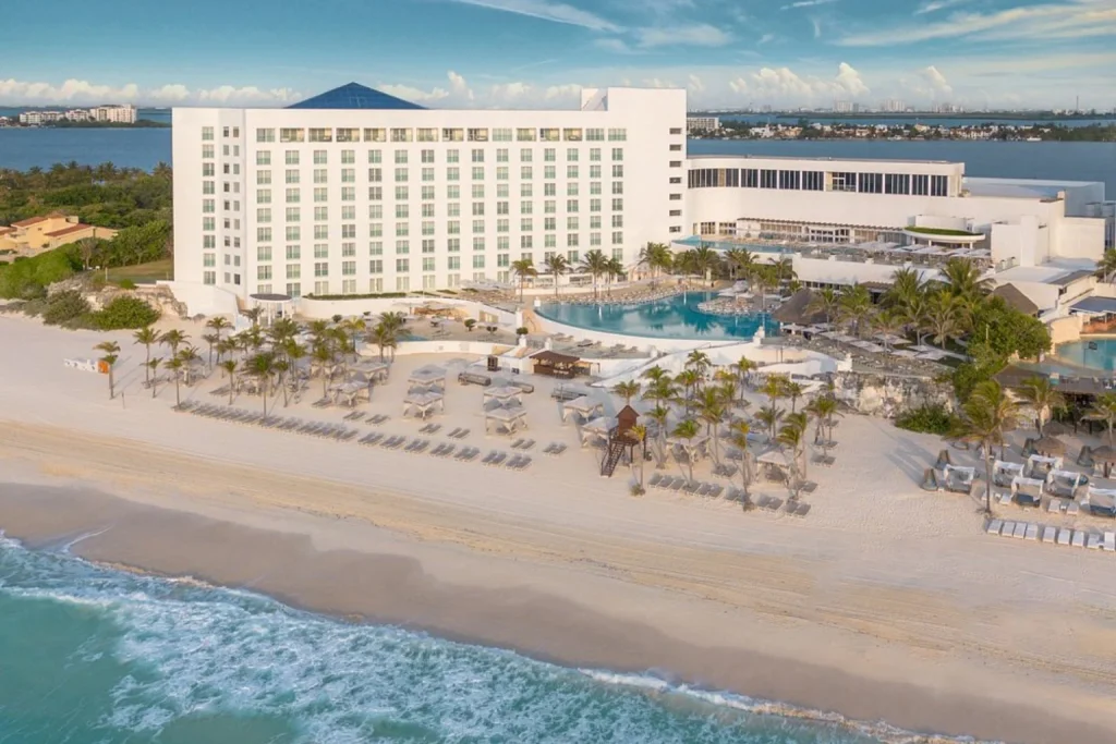 Aerial view of the beachfront resort, swimming pool and white-sand beach beside the Caribbean Sea at Le Blanc Spa Resort Cancun in Cancun.