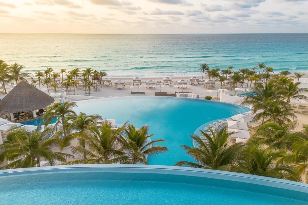 Swimming pools overlooking the beach and Caribbean Sea at Le Blanc Spa Resort Cancun