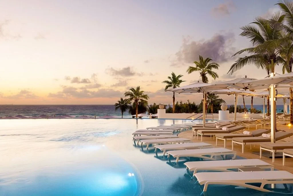 Infinity pool overlooking the Caribbean Sea at Le Blanc Spa Resort Cancun.