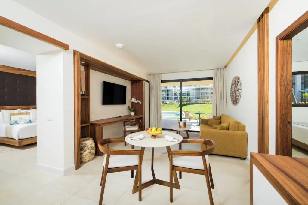 Family Club Suite with living and dining area at Majestic Mirage Costa Mujeres