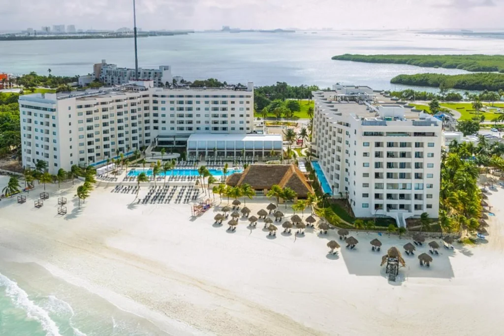 Beachfront resort with a swimming pool, white sand beach and Caribbean waters at Melia Casa Maya Cancun in Cancun.
