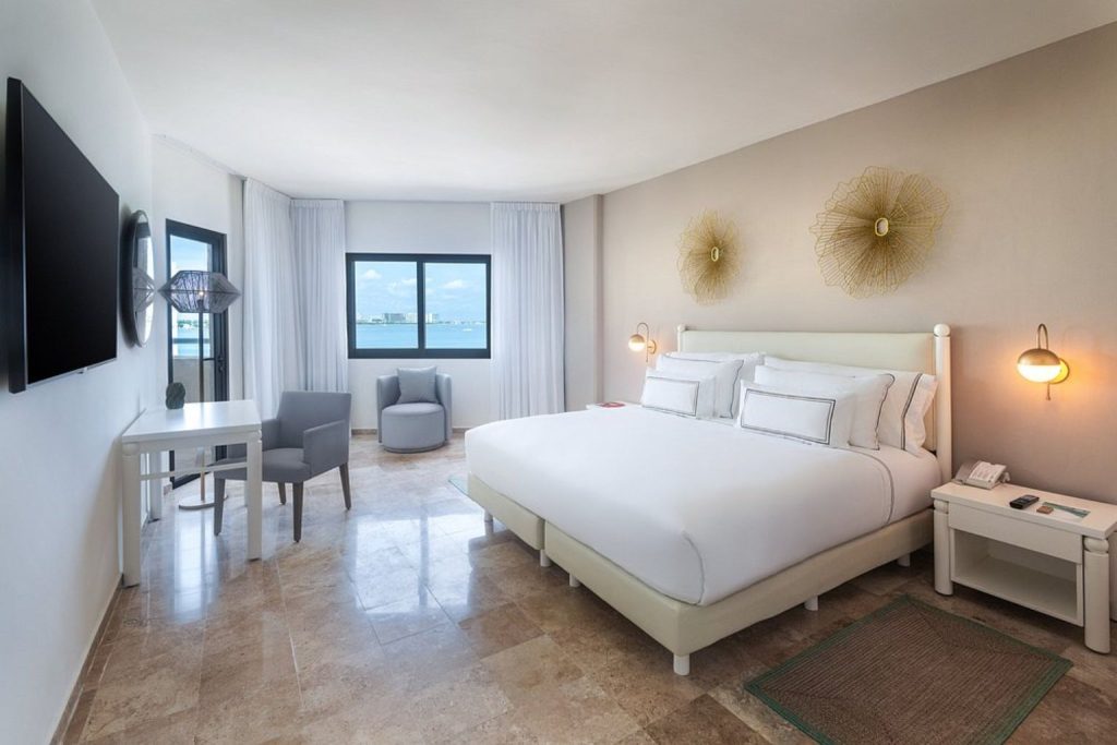 Modern guest room with ocean views at Meliá Casa Maya Cancun in Cancun, Mexico.