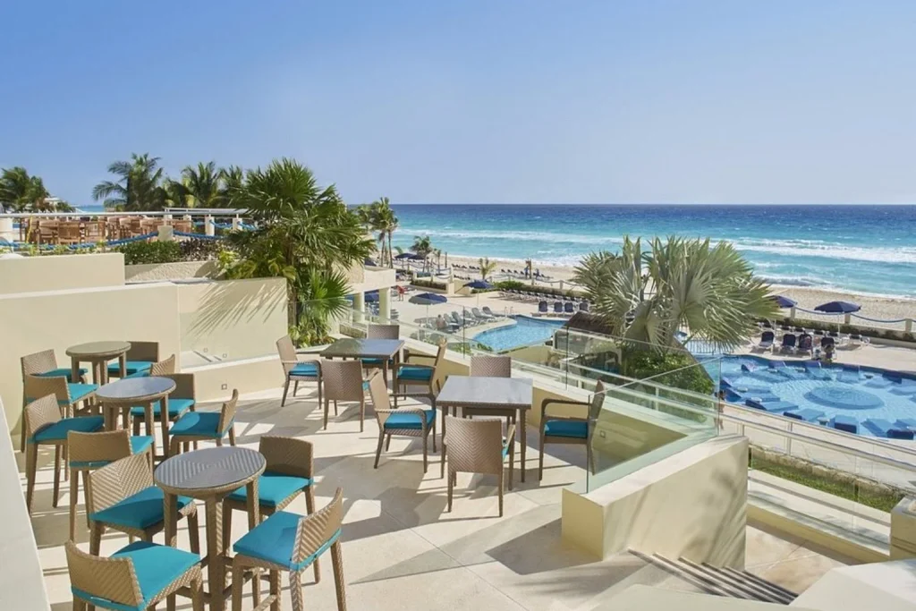 Ocean-view terrace overlooking the pools and Caribbean beach, Occidental Tucancún, Cancun