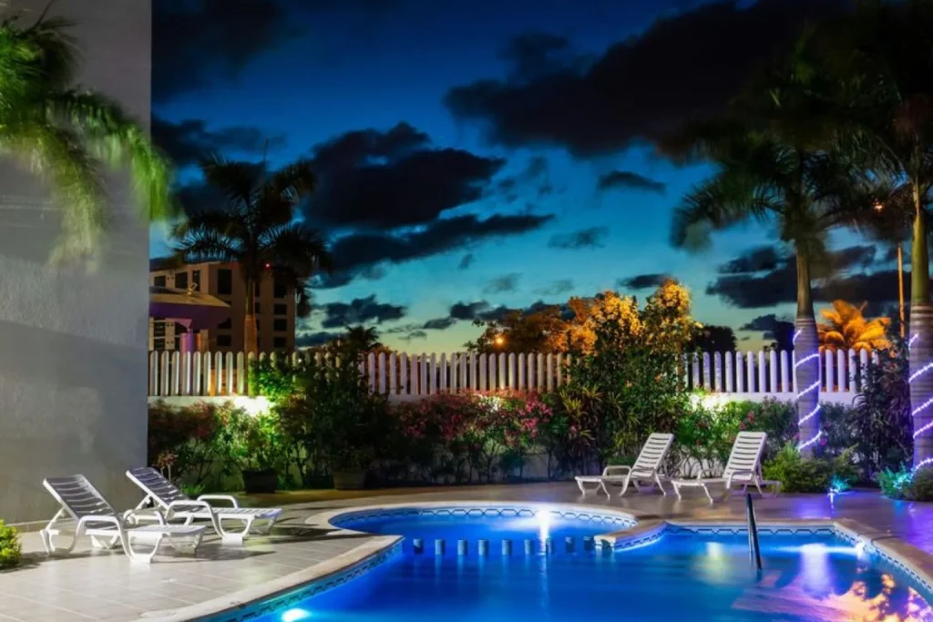 Outdoor pool at night at One Cancun Centro in Cancún, Mexico.
