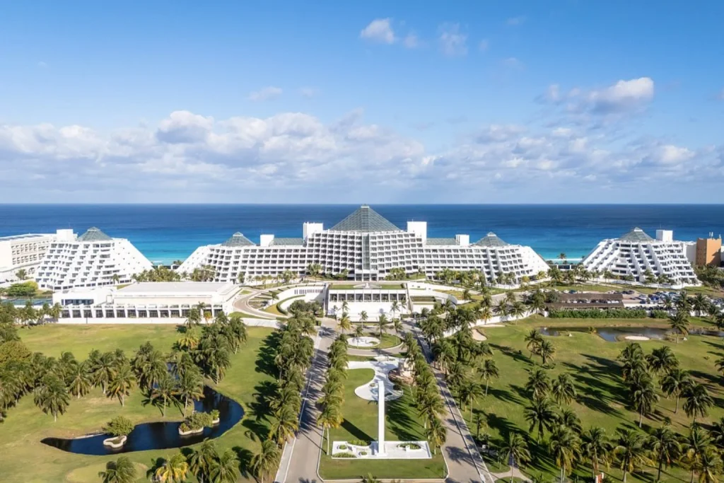 Expansive beachfront resort surrounded by tropical palm gardens and overlooking the Caribbean Sea at Paradisus Cancun in Cancun.