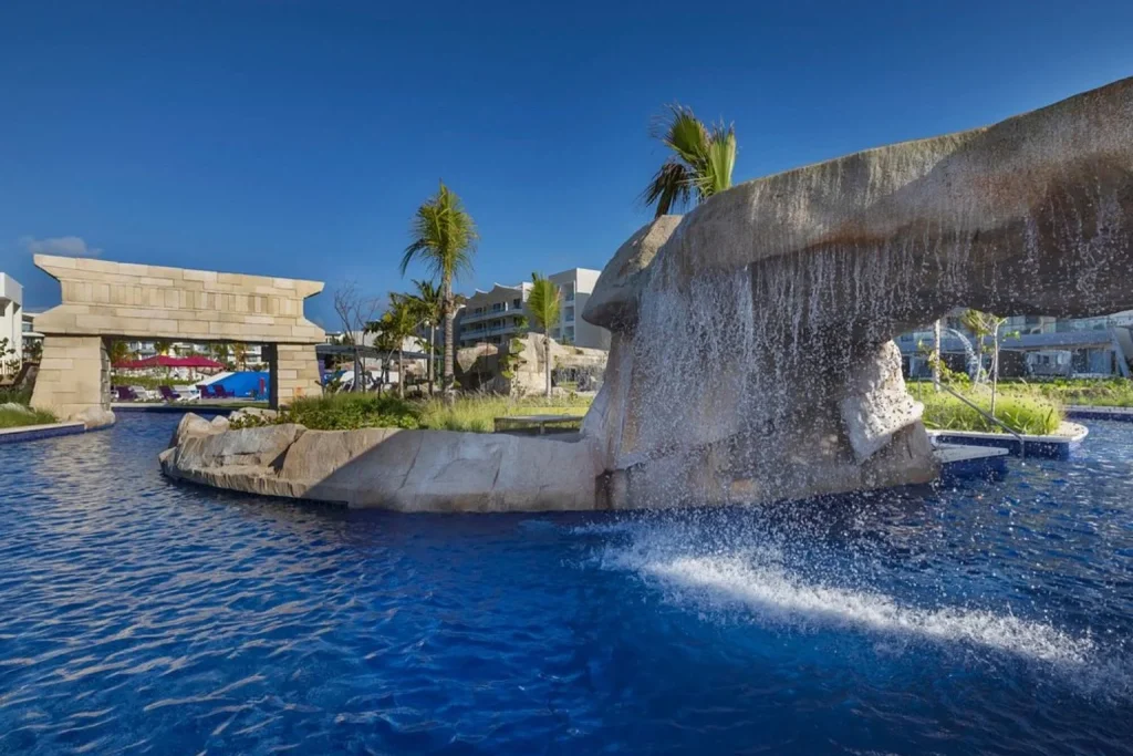 Pool with waterfall feature at Planet Hollywood Cancun by Royalton in Costa Mujeres, Mexico