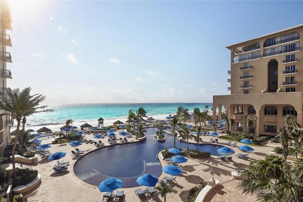 Oceanfront main swimming pool overlooking the Caribbean Sea at The Ritz-Carlton, Cancun in Cancún, Mexico.