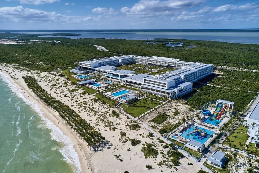 Resort pools and beach overlooking the ocean at Riu Palace Costa Mujeres, Mexico