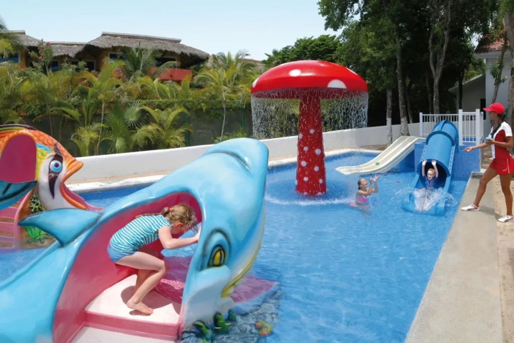 Kids’ water play area with dolphin slide and mushroom fountain at Riu Yucatan, Mexico