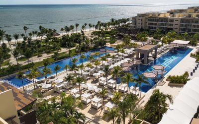 Aerial view of the oceanfront pool and beachfront at Royalton Riviera Cancún