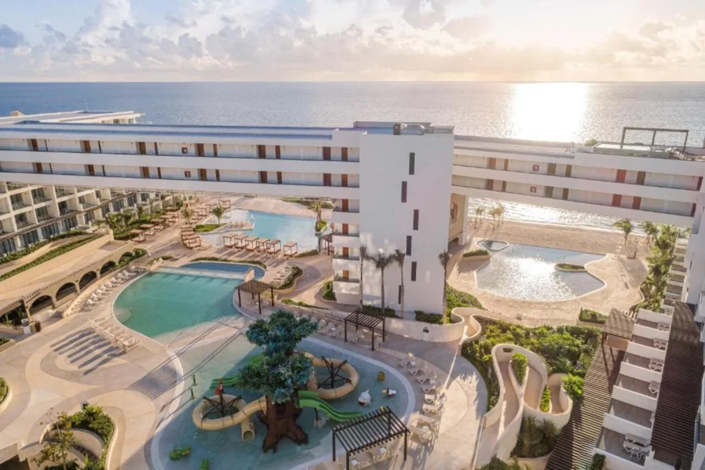 Pools and kids’ water play area with ocean view at Sensira Resort & Spa Riviera Maya, Mexico