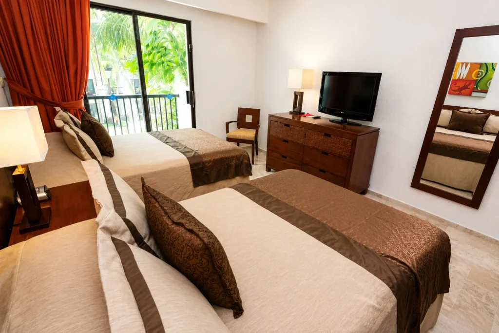 Two-bedroom suite with two beds and balcony at The Royal Cancun
