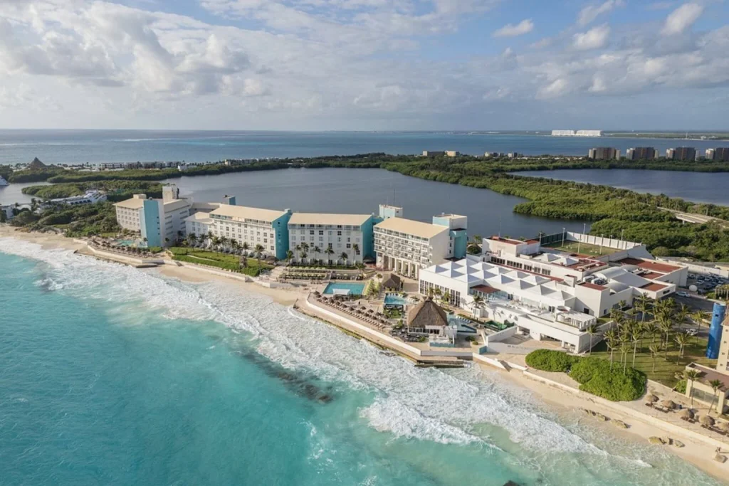 Beachfront resort overlooking the turquoise Caribbean Sea with a lagoon behind at The Westin Resort & Spa in Cancun