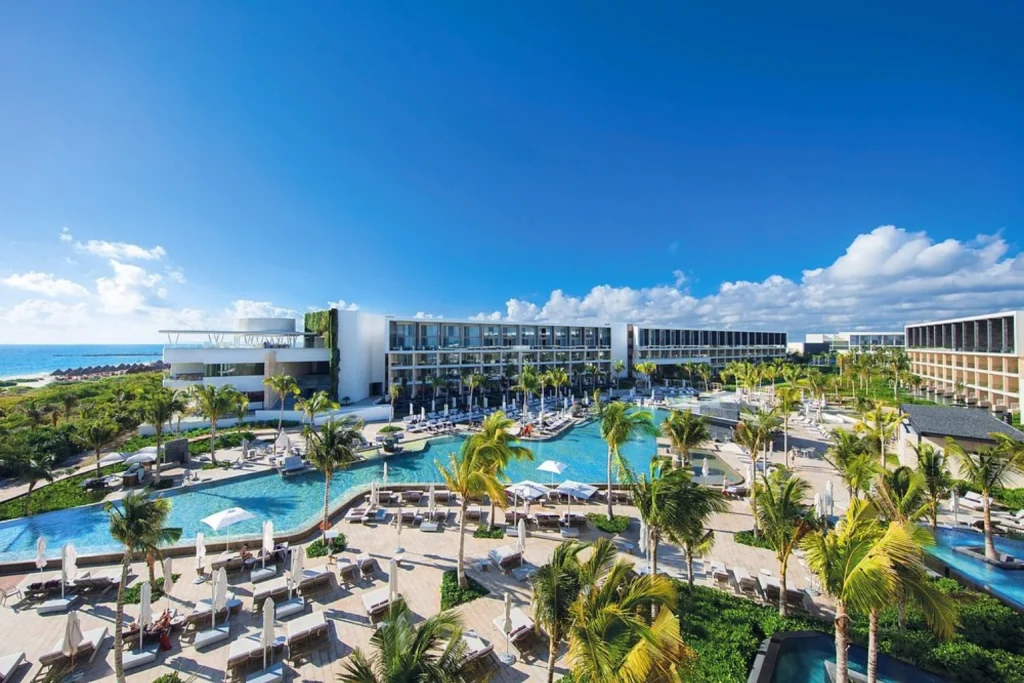 Aerial view of swimming pools and resort grounds at TRS Coral Hotel Costa Mujeres