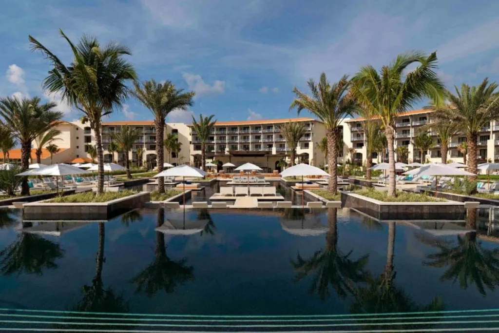 Main infinity pool with tropical landscaping at UNICO 20°87° Hotel Riviera Maya in Akumal, Mexico.