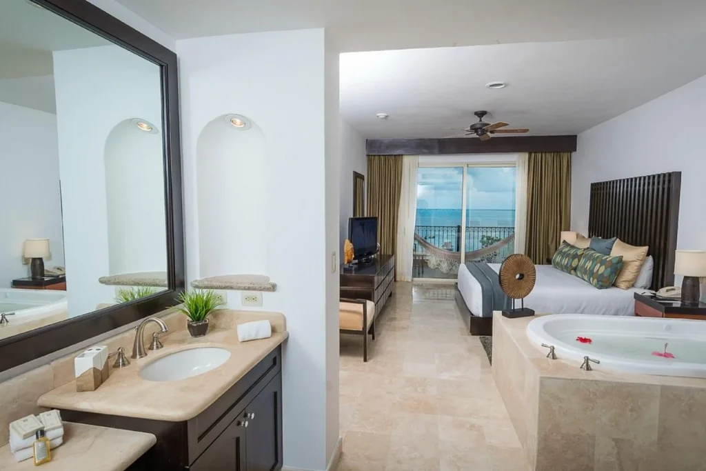 Ocean-view suite with king bed, hammock and private jacuzzi at Villa del Palmar Cancun