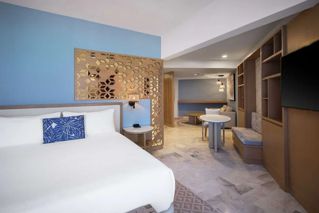 King suite with living area and modern furnishings at Wyndham Grand Cancun